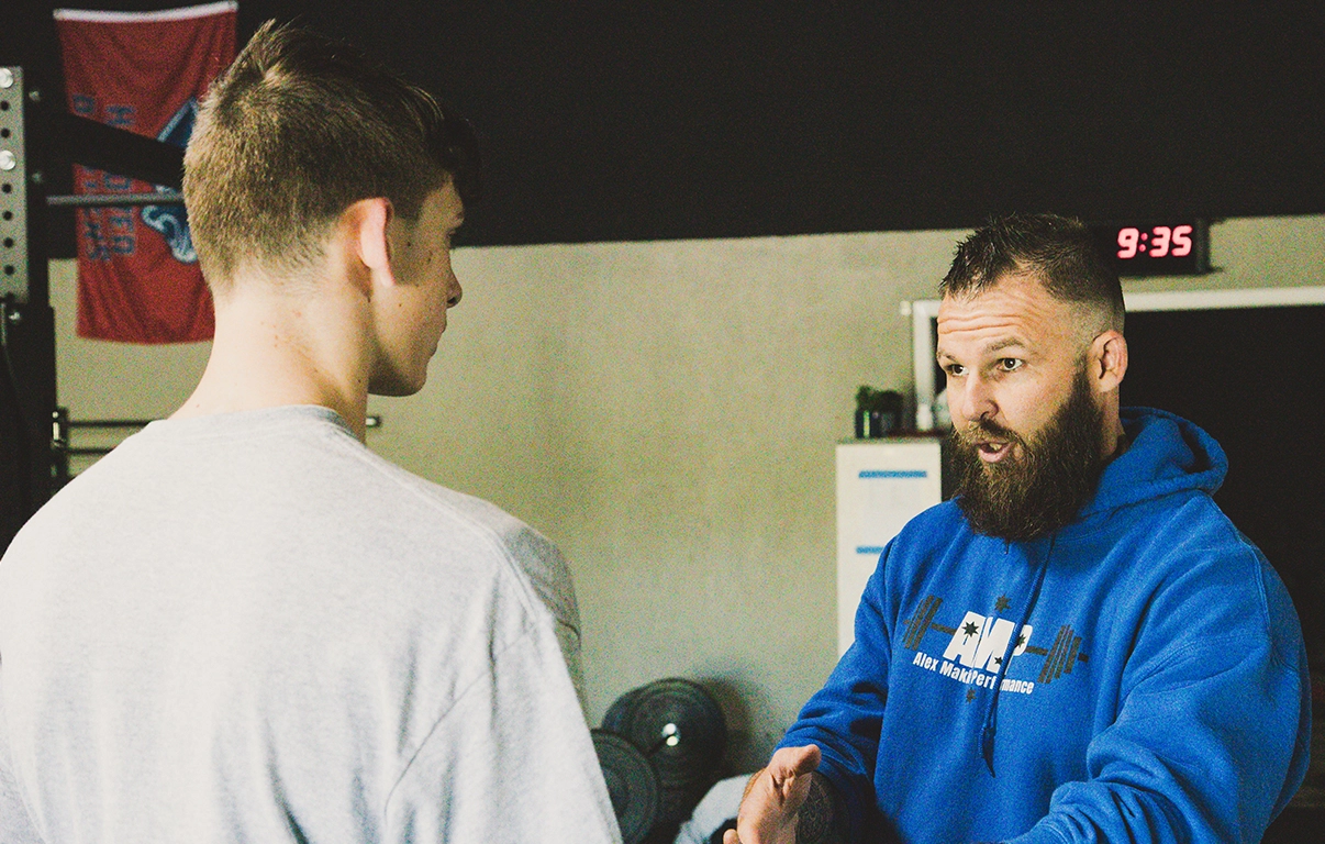 Alex Makin providing one-on-one training to a collegiate athlete at AMP for collegiate athletic training.