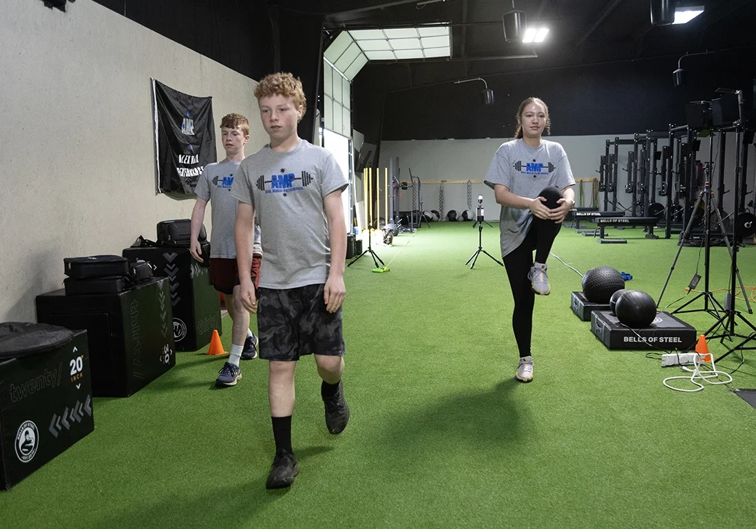 Teen athletes performing warm-up exercises at Alex Makin Performance in the Teen Athletic Training program.