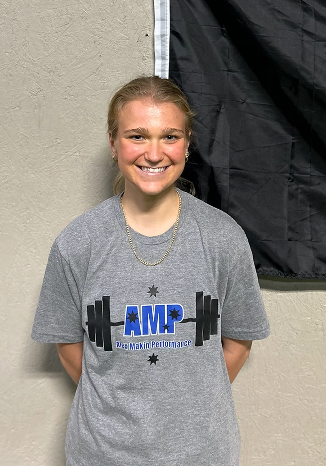 Alex Makin Performance Athletic Trainer Tessa Beesly in AMP gear